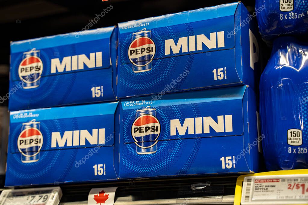 Close up of Pepsi Mini cans in multipack boxes on supermarket shelf. Toronto, Canada - September 20, 2025.