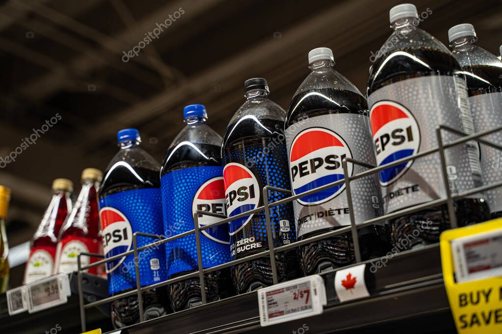 Bottles of Pepsi regular, zero sugar, and diet soda on supermarket shelf. Toronto, Canada - September 20, 2025.