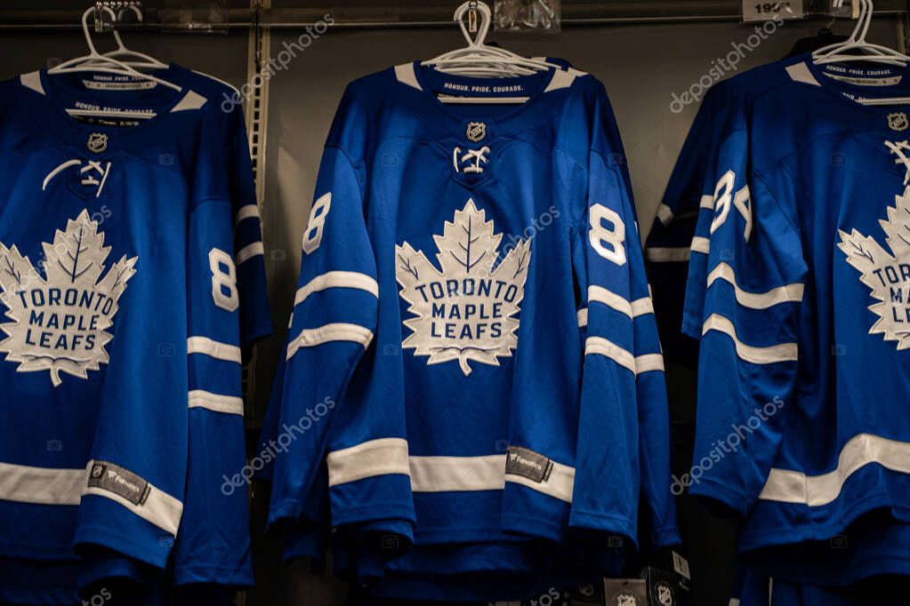 Toronto Maple Leafs hockey jerseys hanging on display in sports store. Toronto, Canada - September 24, 2025.