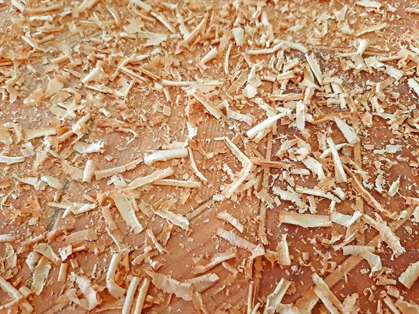Sawdust on wooden background texture close up — Stock Photo, Image