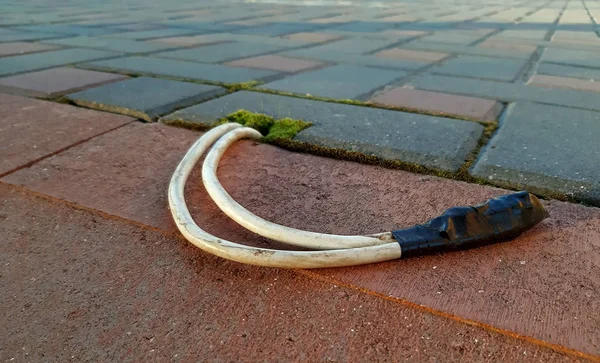 Electric cable installed under pavement, light installation concept