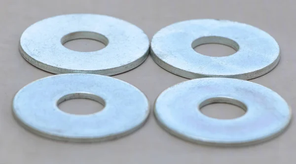 Four Flat Metal Washers Gray Background — Stock Photo, Image