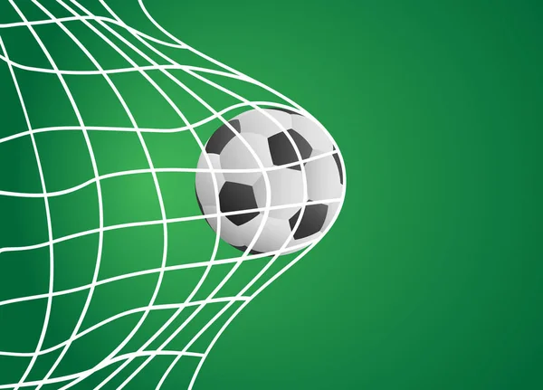 Yeşil arka planda beyaz net ile kalede futbol topu. 