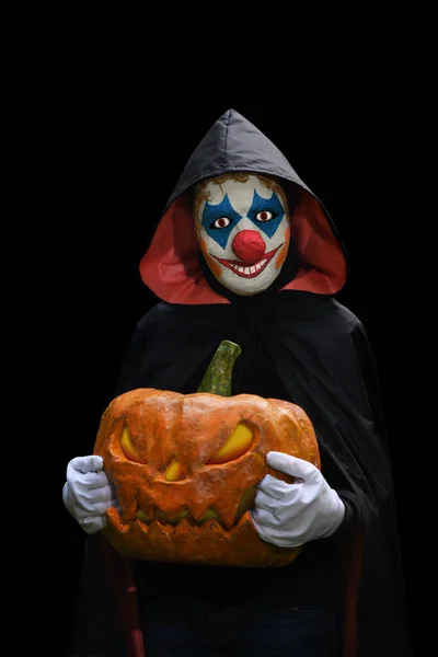 Страшный Клоун Тыквой Руках Черном Фоне Хэллоуин — стоковое фото