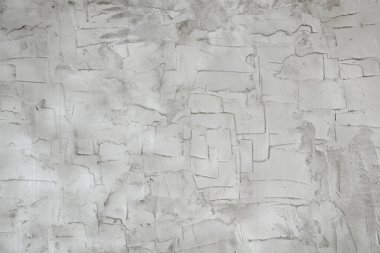 Duvar çimento harcı ile sıvanmış. Gri arkaplan