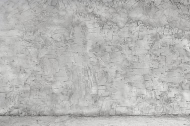 Gri beton duvar, kabaca harçla kaplanmış. Binaların tamiri. Tasarım için arkaplan.
