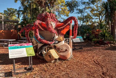 Naples, Florida, USA - December 23, 2018: Octavia the Octopus Sculpture made of garbage found in the ocean as part of the Washed Ashore art exhibit and environmental movement showcased at the Naples Zoo. clipart