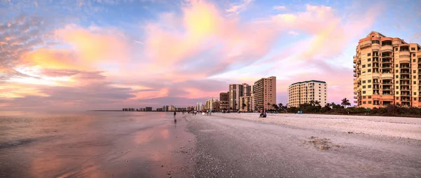 Pink and gold sunset sky over South Marco Island Beach in Florida