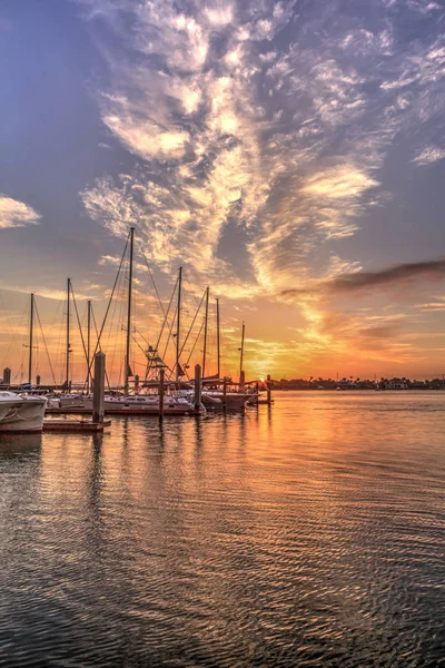 Break of dawn sunrise over boats and sailboats at Factory Bay ma — Stock Photo, Image