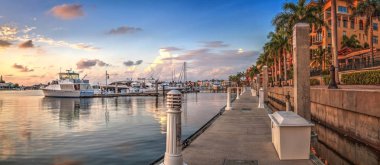 Sunset over the boats in Esplanade Harbor Marina in Marco Island clipart