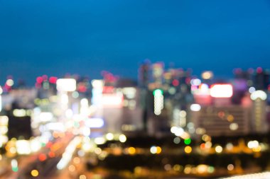 Soyut arka plan için alacakaranlık zamanında bulanık şehir.