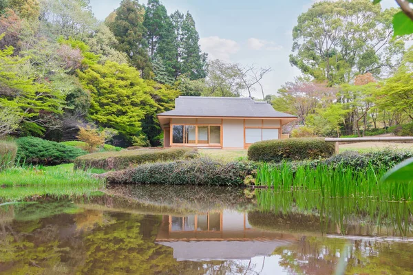 The scenic landscape. house by pond. Reflection in water. Forest surround the house.