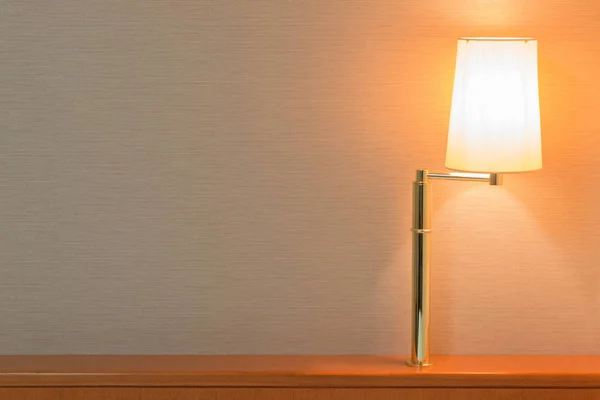 Table lamp on headboard lighting interior design.