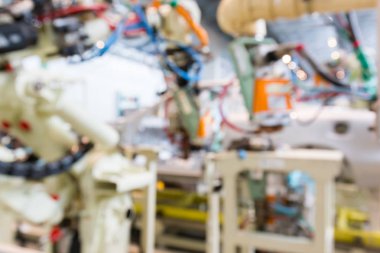 Araba üretim fabrikası Makina ve robot otomat tarafından iç arka plan bulanık. iş araba sanayi deneyimi kullanmak olabilir.