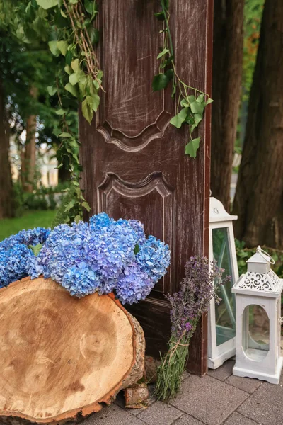 Flowered wedding wall. Decor with color hydrangea and roses. Wedding wall for ceremony and photo.