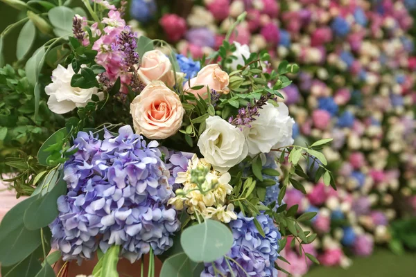 Flowered wedding wall. Decor with color hydrangea and roses. Wedding wall for ceremony and photo.