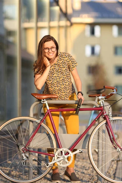 Girl with bicycle  lock. Bicycle U- lock