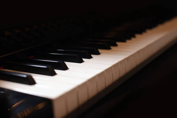 Piano keys on black background