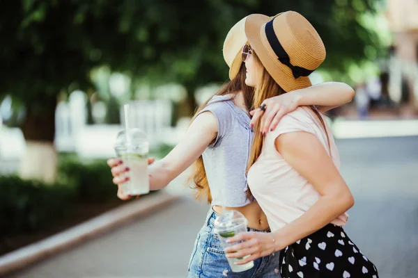 Two Happy Young Women Hugging Laughing Outdoors — Stock Photo, Image