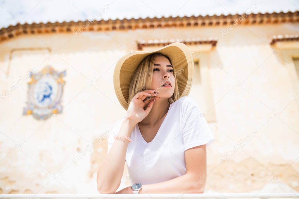 portrait of beautiful woman on the terrace in the heart of old city