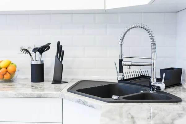 Fancy sink in a mostly white modern kitchen — Stock Photo, Image