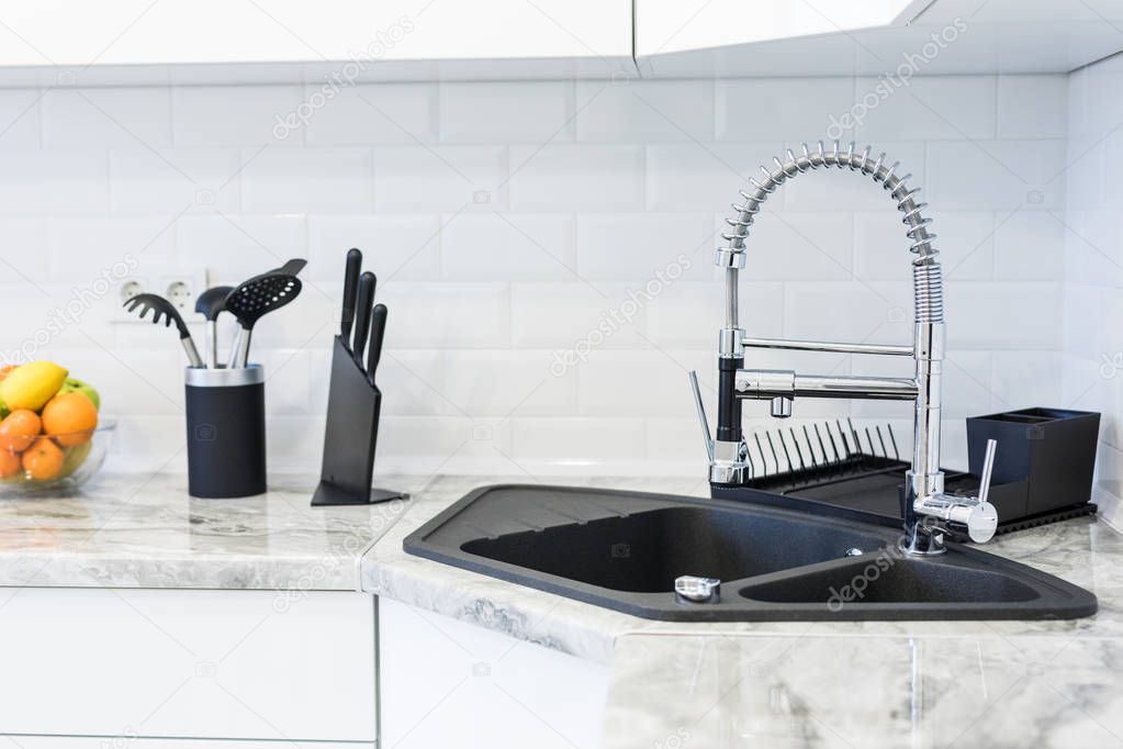 Fancy sink in a mostly white modern kitchen