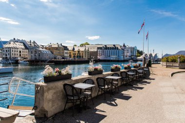 Alesund, Norway - June 2019: View of colorful Art Nouveau architecture in the port of the city of Alesund, Norway. clipart
