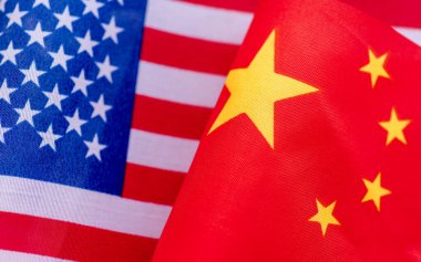 A close up of the USA national flag next to the Chinese national flag. A USA, China relations concept.