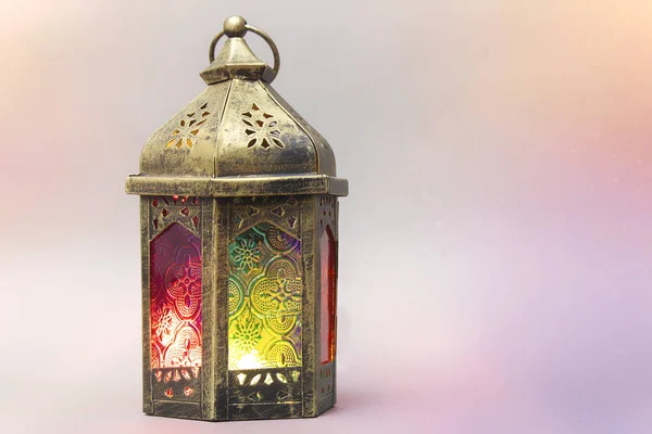 Ramadan Kareem. Decorative Arabic lantern with a burning candle. Festive greeting card with light effects, invitation to the Muslim holy holiday. — Stock Photo, Image