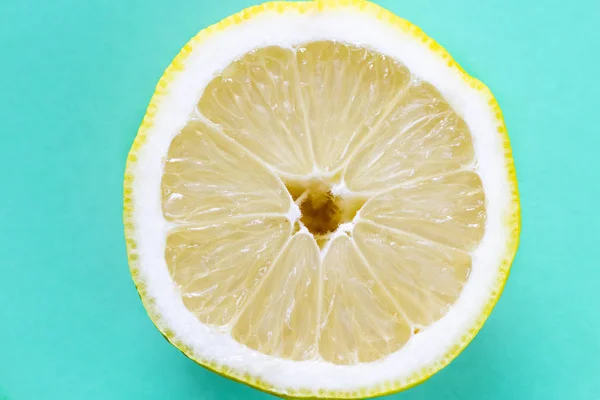 Opened lemon isolated on a blue background