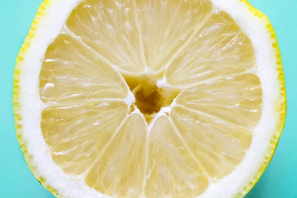 Opened lemon isolated on a blue background