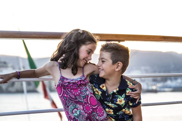 Portrait of a two little friends on a cruise at summer