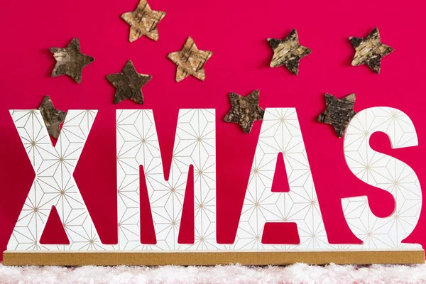 Xmas text with stars on a pink background.