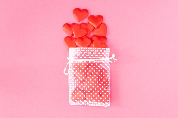 Transparent gift bag full of hearts. Valentines Day concept.