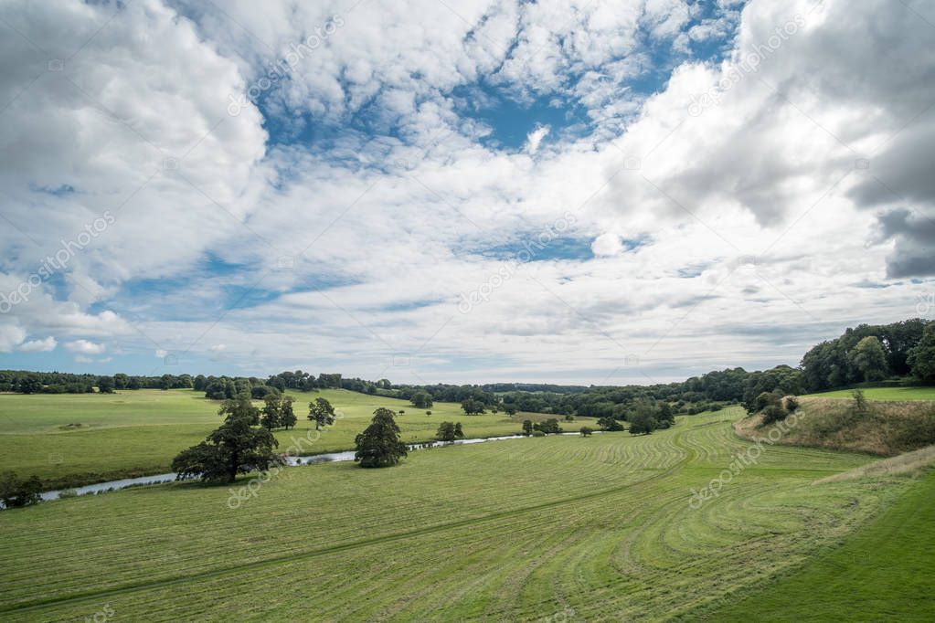 View of green field with River Aln, taken from Alnwick Castle