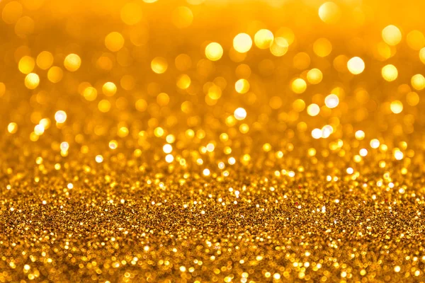 Złote świecące światła romantyczne tło musujące błyszczące. — Zdjęcie stockowe