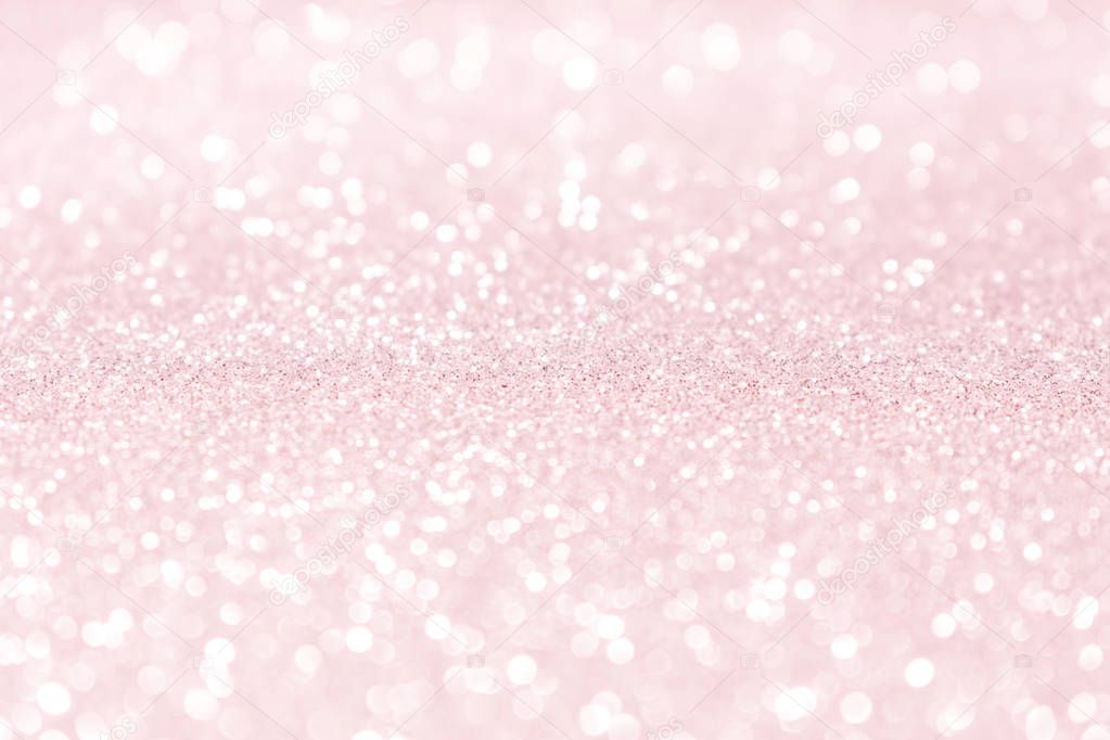 Pink rose bokeh glitter sparkle background.