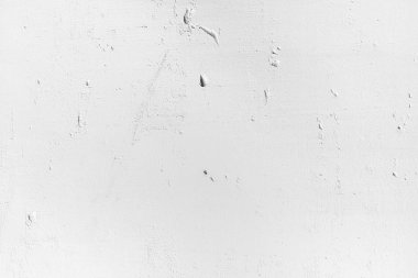 Beyaz duvar gözenekli malzeme. Küçük delikler ve çatlaklar ile hafif pürüzlü yüzeye. Arka plan için eski beyaz beton duvar dokusu.