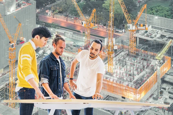 Three Multiethnic Engineer Architect Team Work Together Building Development Project — Stock Photo, Image