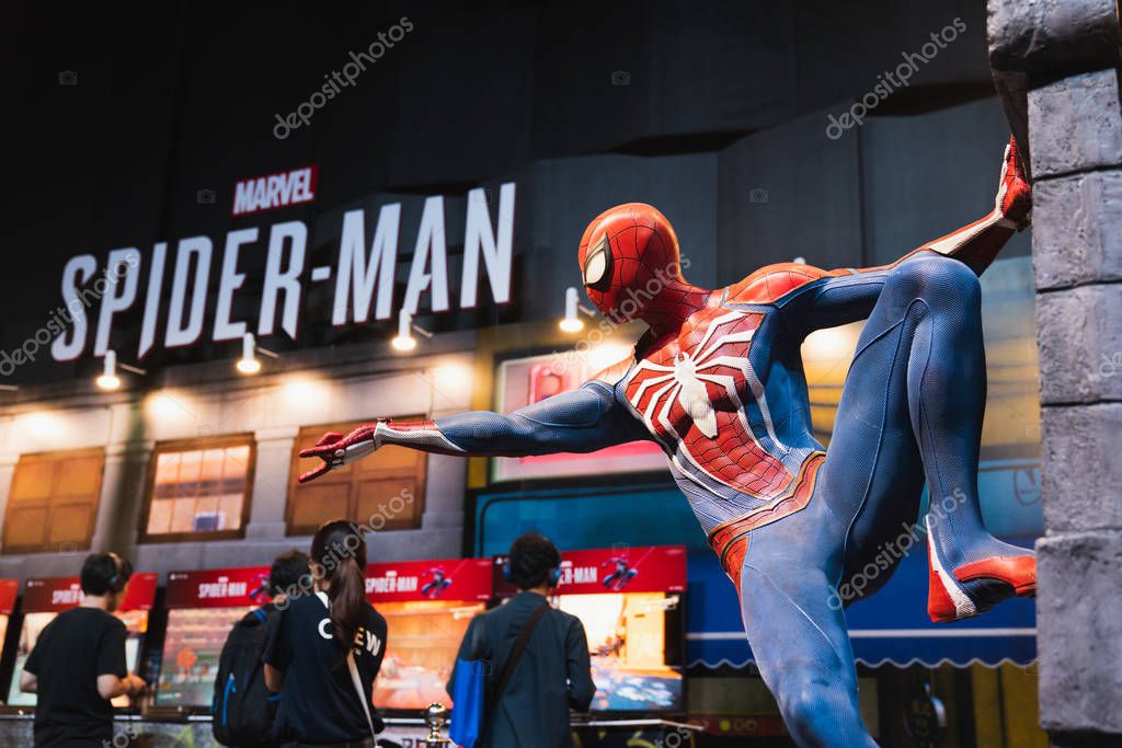 Bangkok, Thailand - Aug 18, 2018: New Spider-Man PS4 game event in PlayStation Experience SEA (South East Asia) 2018. Spiderman model showing at demo booth with gamer playing trial version of the game