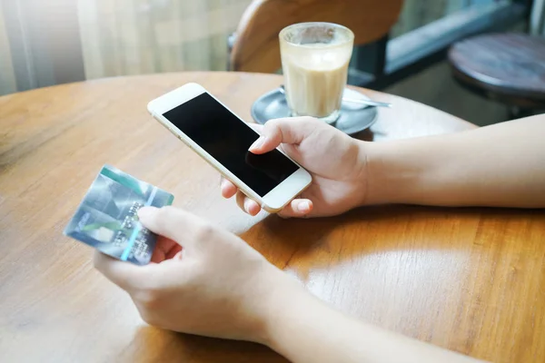 woman hand using smartphone for mobile transaction or shopping o