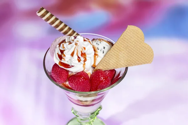 Tasty strawberry ice cream cups decorated with waffles