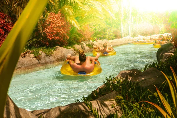 People floating on lazy river in Siam Park, Tenerife, Spain.