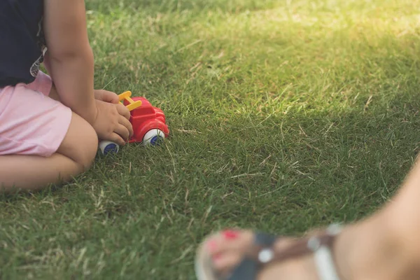 Little Girl Playing Red Car Garden Grass — Stock Photo, Image