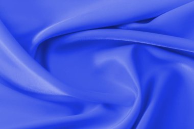 Pürüzsüz zarif mavi ipek veya saten lüks bez doku soyut tatil arka plan olarak kullanabilirsiniz. Lüks Noel arka plan veya yeni yıl arka plan tasarım.