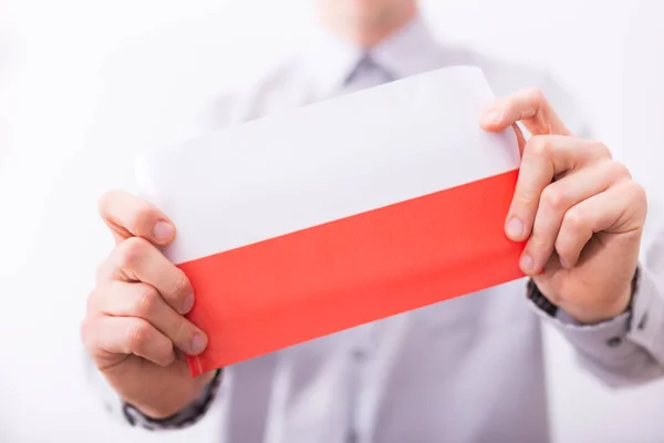 Male Hands Holding Polish National Flag — Stock Photo, Image