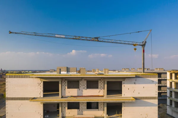 Multi-family building under construction, aerial view.