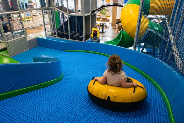 Little Girl Rides Wheel Slide Children Play Center — Stock Photo, Image