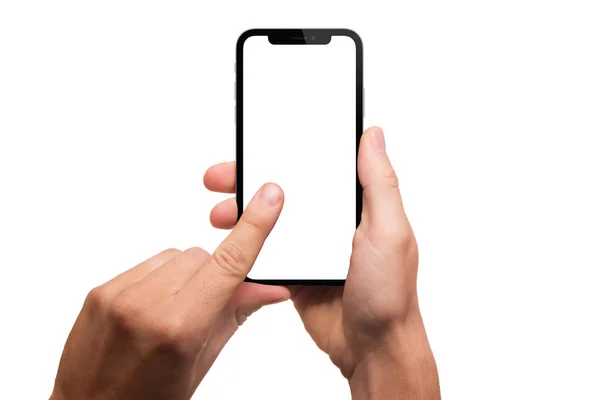 Manos sosteniendo smartphone con pantalla en blanco aislada sobre fondo blanco. Mano que sostiene el teléfono negro moderno en posición vertical. mockup teléfono de moda . — Foto de Stock