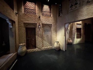 Rustic urban courtyard showcasing historic architecture with decorative elements and soft shadows.